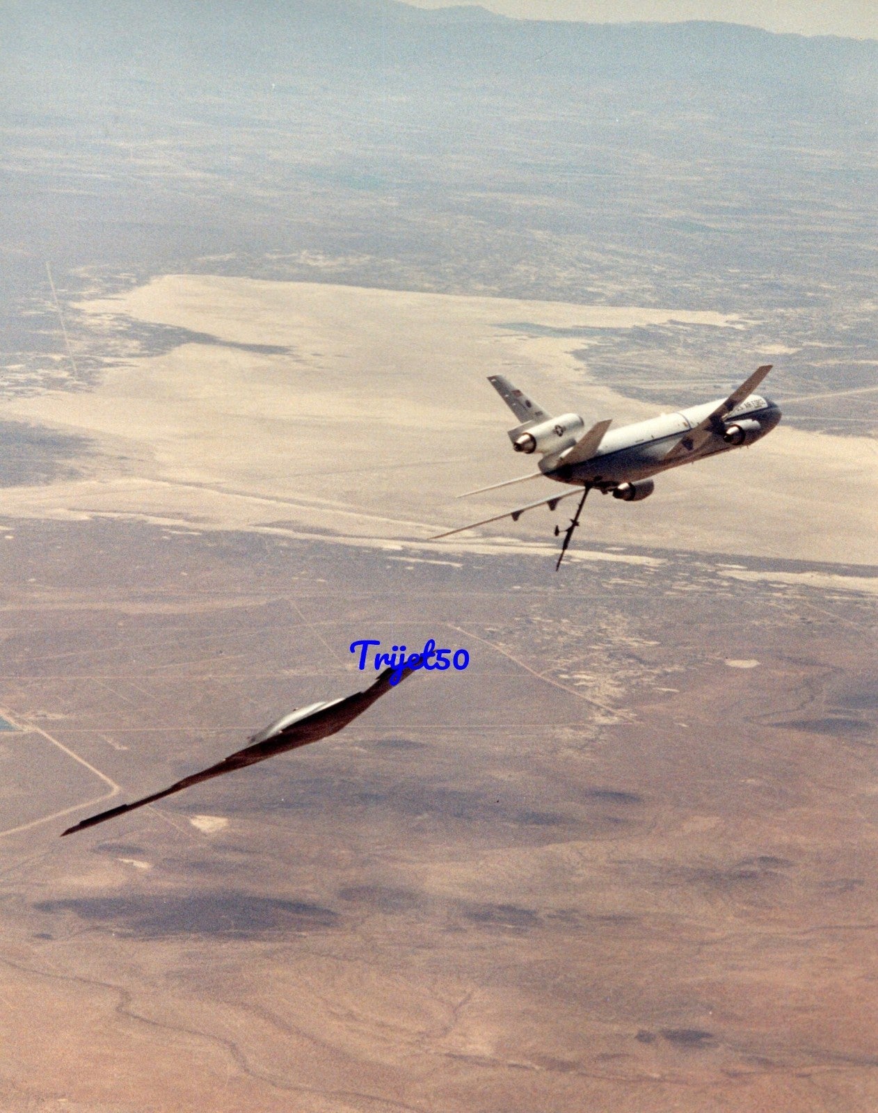 8X10 Colour Photo Northrop B-2 following a banking KC-10 Extender